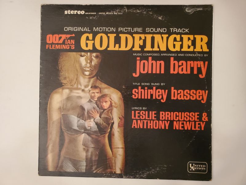 John Barry (music), Shirley Bassey (title song), Leslie Bricusse & Anthony Newley (lyrics) Goldfinger (Original Motion Picture Sound Track) vinyl record